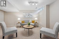 Living room with carpet flooring and baseboards - 