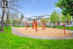 Community playground featuring a residential view - 