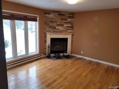 Salon - 13482 Rue Brault, Mirabel, QC - Indoor With Fireplace