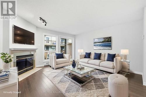 205 Briston Private, Ottawa, ON - Indoor Photo Showing Living Room With Fireplace