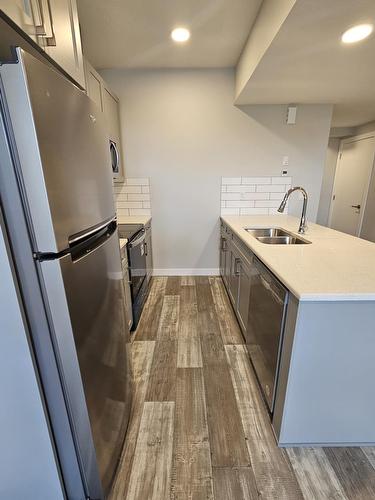 8069-8073  Cedric Mah Rd, Edmonton, AB - Indoor Photo Showing Kitchen With Double Sink
