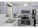 2395 Pleasant Valley Road Unit# 14, Armstrong, BC  - Indoor Photo Showing Kitchen With Double Sink 