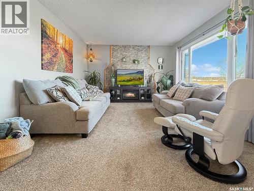 132 Haw Place, Swift Current, SK - Indoor Photo Showing Living Room With Fireplace