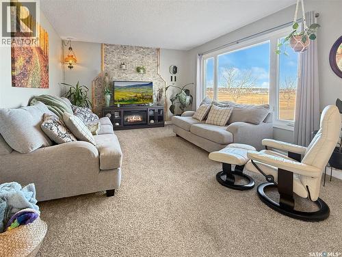 132 Haw Place, Swift Current, SK - Indoor Photo Showing Living Room With Fireplace