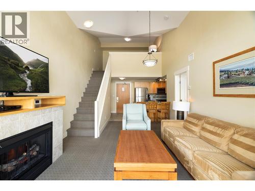 Vaulted ceilings w/ loft in the background. - 4205 Gellatly Road Unit# 416, West Kelowna, BC - Indoor Photo Showing Living Room With Fireplace