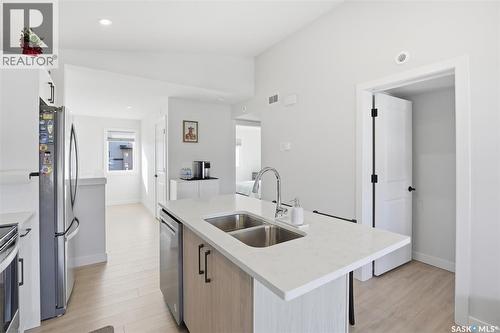 30 651 Dubois Crescent, Saskatoon, SK - Indoor Photo Showing Kitchen With Double Sink