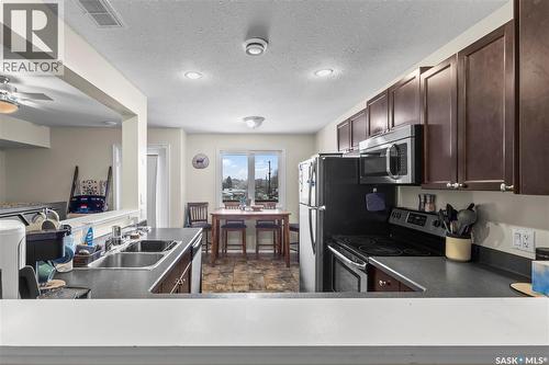 217 515 28Th Street E, Prince Albert, SK - Indoor Photo Showing Kitchen With Double Sink