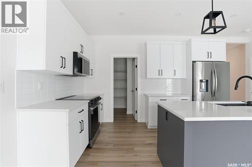 211 Sharma Lane, Saskatoon, SK - Indoor Photo Showing Kitchen With Upgraded Kitchen
