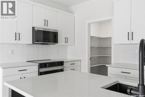 211 Sharma Lane, Saskatoon, SK - Indoor Photo Showing Kitchen With Upgraded Kitchen