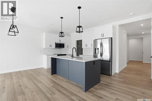211 Sharma Lane, Saskatoon, SK - Indoor Photo Showing Kitchen With Upgraded Kitchen