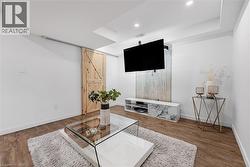 Bar area with light wood-style flooring and recessed lighting - 