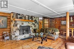 Wood Insert in Stone Fireplace - 