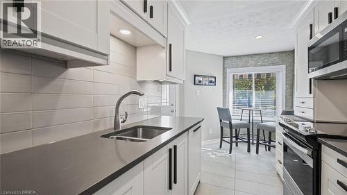 23 Freeman Crescent, Simcoe, ON - Indoor Photo Showing Kitchen With Double Sink With Upgraded Kitchen