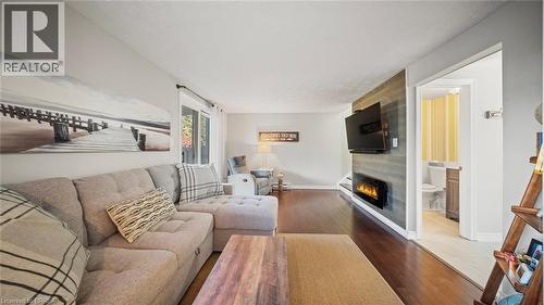 23 Freeman Crescent, Simcoe, ON - Indoor Photo Showing Living Room With Fireplace