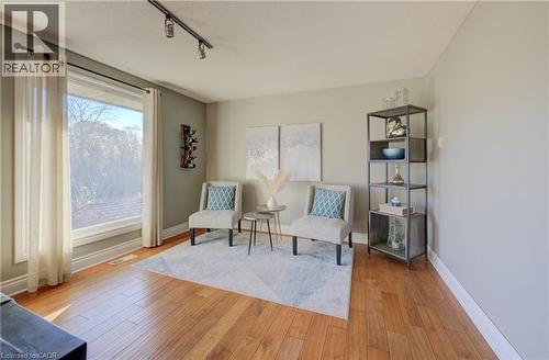 Sitting room with light wood-type flooring and track lighting - 47 Manor Drive, Kitchener, ON - Indoor