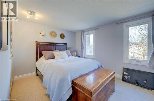 Carpeted bedroom featuring multiple windows - 47 Manor Drive, Kitchener, ON - Indoor Photo Showing Bedroom