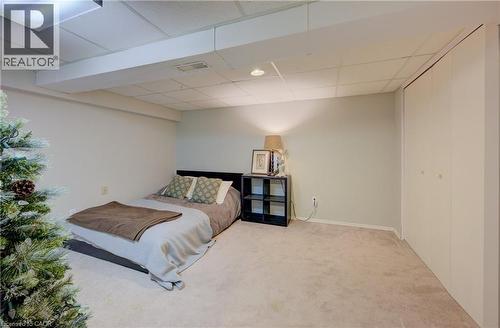 Carpeted bedroom featuring a drop ceiling - 47 Manor Drive, Kitchener, ON - Indoor Photo Showing Bedroom