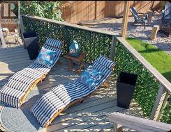 LOWER DECK with loungers by the pool - 