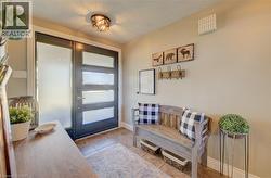 Tiled foyer featuring a textured ceiling - 
