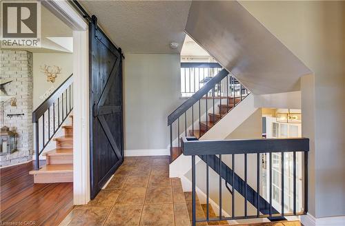 Entryway featuring a textured ceiling and a barn door - 47 Manor Drive, Kitchener, ON - Indoor Photo Showing Other Room