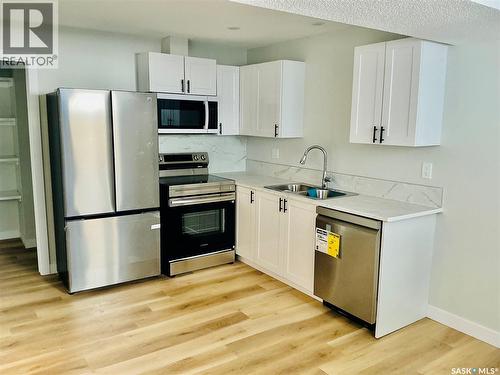 111 Stromberg Crescent, Saskatoon, SK - Indoor Photo Showing Kitchen With Double Sink