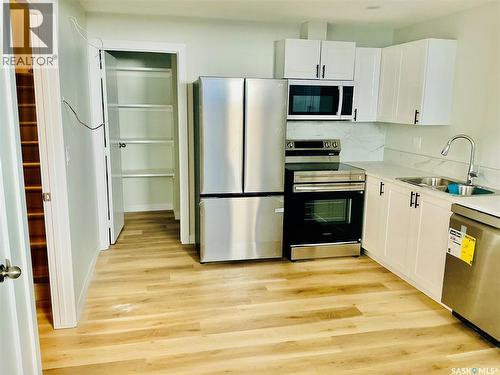 111 Stromberg Crescent, Saskatoon, SK - Indoor Photo Showing Kitchen With Double Sink