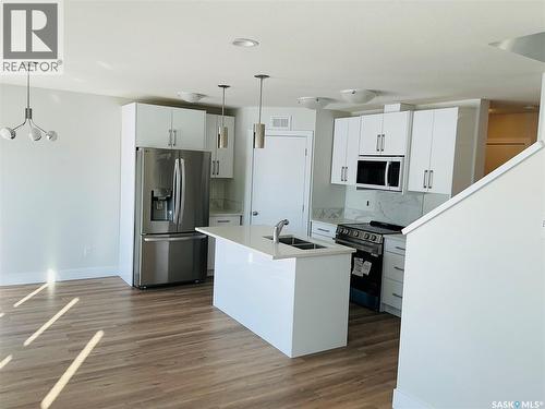 111 Stromberg Crescent, Saskatoon, SK - Indoor Photo Showing Kitchen With Double Sink