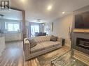 44 - 700 Harmony Road N, Oshawa, ON  - Indoor Photo Showing Living Room With Fireplace 