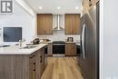 3204 Favel Drive, Regina, SK  - Indoor Photo Showing Kitchen With Stainless Steel Kitchen With Double Sink 