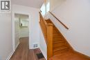 Stairs with wood finished floors and baseboards - 136 Glen Road, Hamilton, ON  - Indoor Photo Showing Other Room 