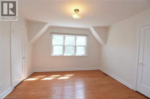 Additional living space featuring lofted ceiling and light wood-style floors - 136 Glen Road, Hamilton, ON - Indoor Photo Showing Other Room