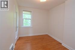 Unfurnished room featuring light wood-style flooring - 