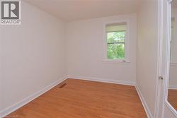 Empty room featuring light wood-style floors and baseboards - 