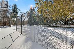 View of yard featuring a tennis court - 