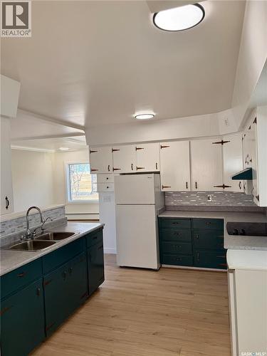 133 Railway Avenue, Ponteix, SK - Indoor Photo Showing Kitchen With Double Sink