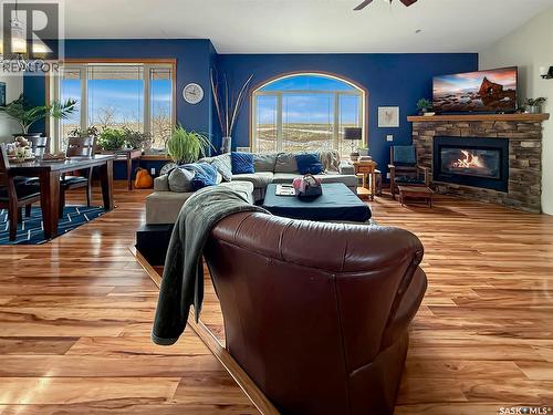 The Landing Acreage, Saskatchewan Landing, SK - Indoor Photo Showing Living Room With Fireplace