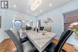 Dining area featuring light wood finished floors and recessed lighting - 