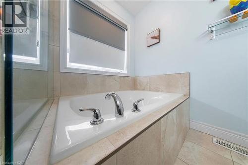 Full bathroom featuring a bath and light tile patterned floors - 59 Greti Drive, Hamilton, ON - Indoor Photo Showing Bathroom