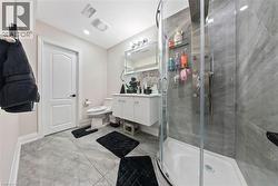 Bathroom with vanity and a stall shower - 