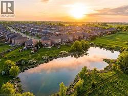 Aerial view of residential area featuring a nearby body of water - 