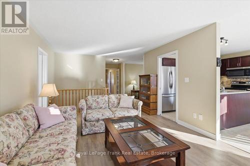 Pocket door by Fridge closes off Kitchen from LR. - 25 Apple Tree Crescent, Uxbridge, ON - Indoor Photo Showing Living Room