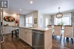 Kitchen island with gorgeous quartz counters! - 