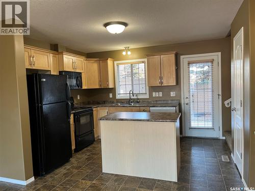 164 4801 Child Avenue, Regina, SK - Indoor Photo Showing Kitchen With Double Sink