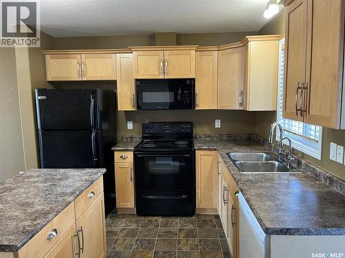 164 4801 Child Avenue, Regina, SK - Indoor Photo Showing Kitchen With Double Sink