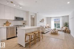 #108 12550 140 AV NW  Edmonton, AB T5X 6J4