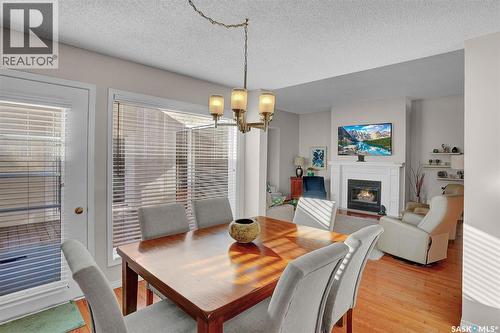 72 Kensington Crescent, Regina, SK - Indoor Photo Showing Dining Room With Fireplace