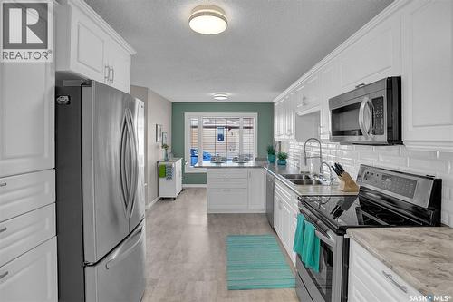72 Kensington Crescent, Regina, SK - Indoor Photo Showing Kitchen With Double Sink
