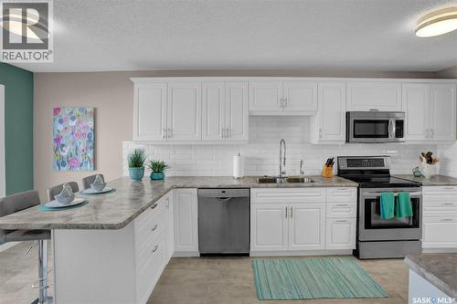 72 Kensington Crescent, Regina, SK - Indoor Photo Showing Kitchen With Double Sink With Upgraded Kitchen