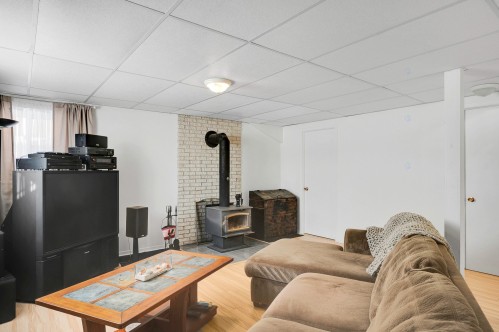 Salon - 202 Rue Des Pins, Prévost, QC - Indoor With Fireplace