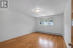 Primary bed- carpet was lifted to show hardwood - 